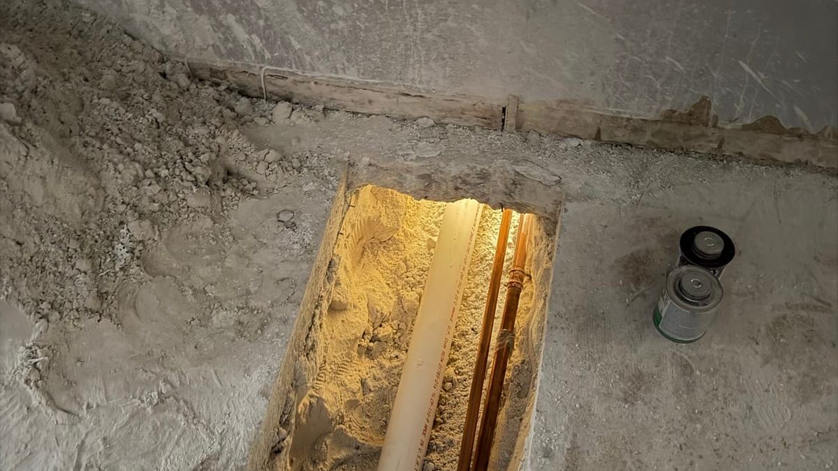 Drain and copper lines in an opened slab during a Miami Dade Plumbing repair