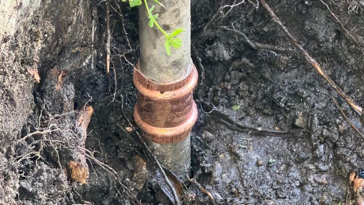 Sewer line coupling in Miami soil during a Miami Dade Plumbing repair