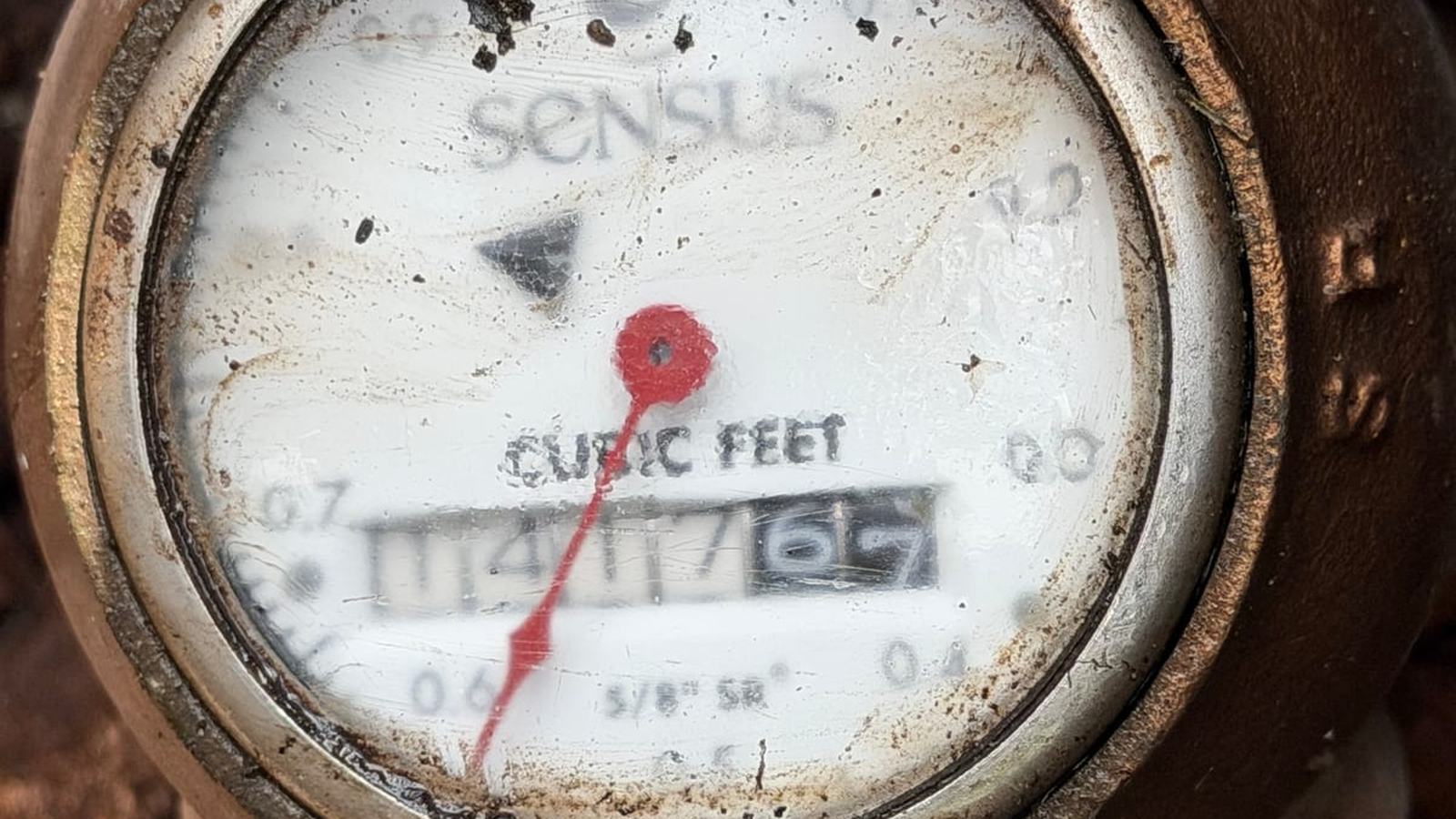 Close-up of a residential water meter during a leak check by Miami Dade Plumbing